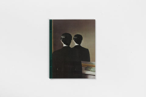 A book with a green spine and a painting of a figure and the figure’s reflection in the mirror