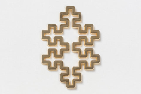 shiny gold pin with a geometric shape