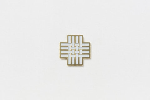 A square pin with a white hashtag and gold edges